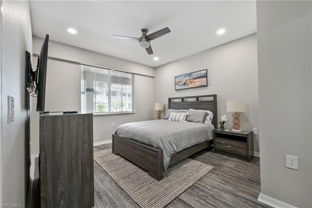 Bedroom featuring a ceiling fan, wood finished floors, and recessed lighting