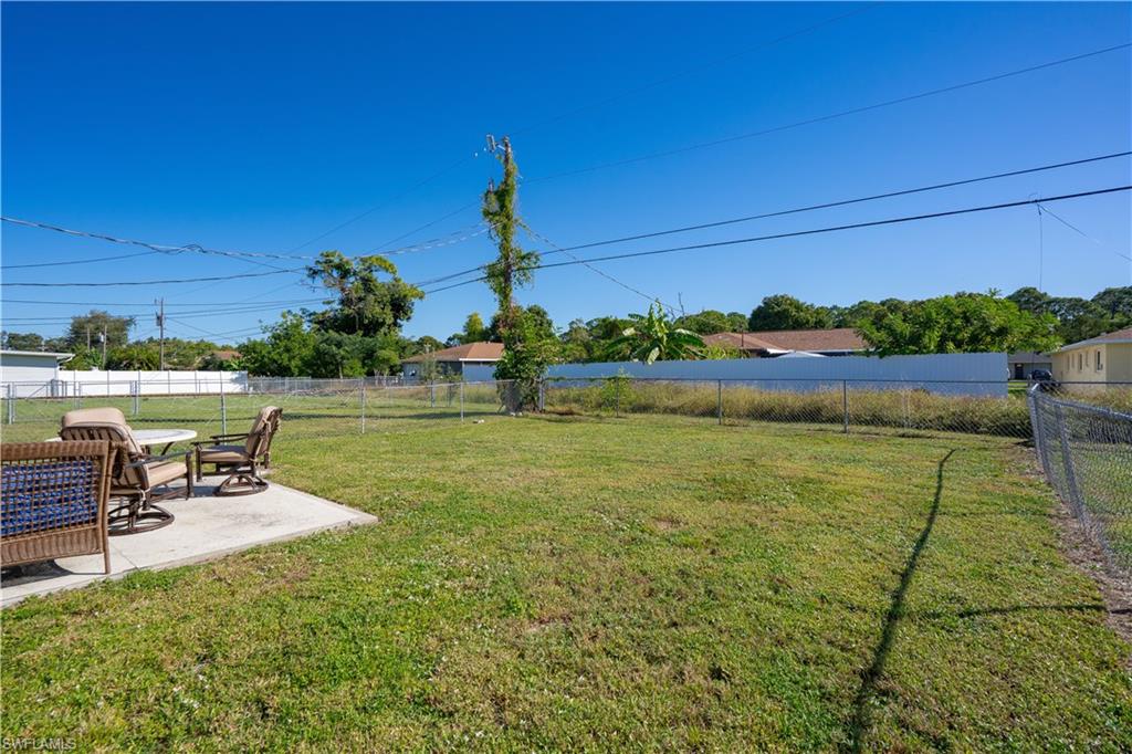 Fenced backyard with a patio