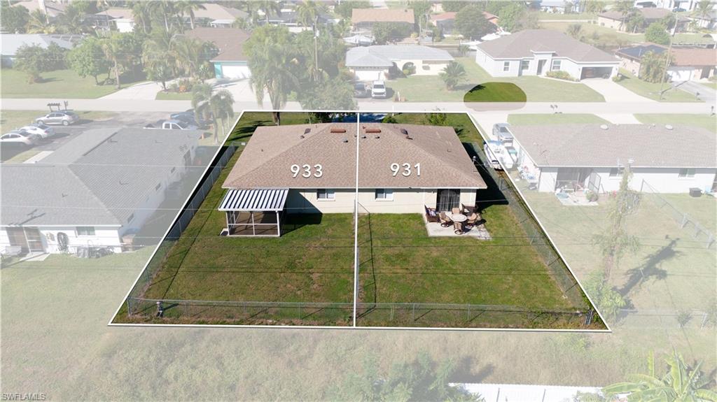 Aerial view of residential area with property parcel outlined