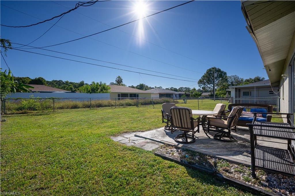 Fenced backyard with a patio and outdoor dining space