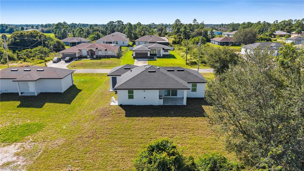 Aerial perspective of suburban area featuring a tree filled landscape