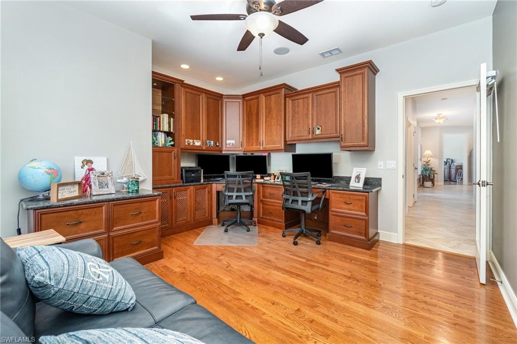 Home office featuring a ceiling fan, built in study area, light wood-style flooring, and recessed lighting