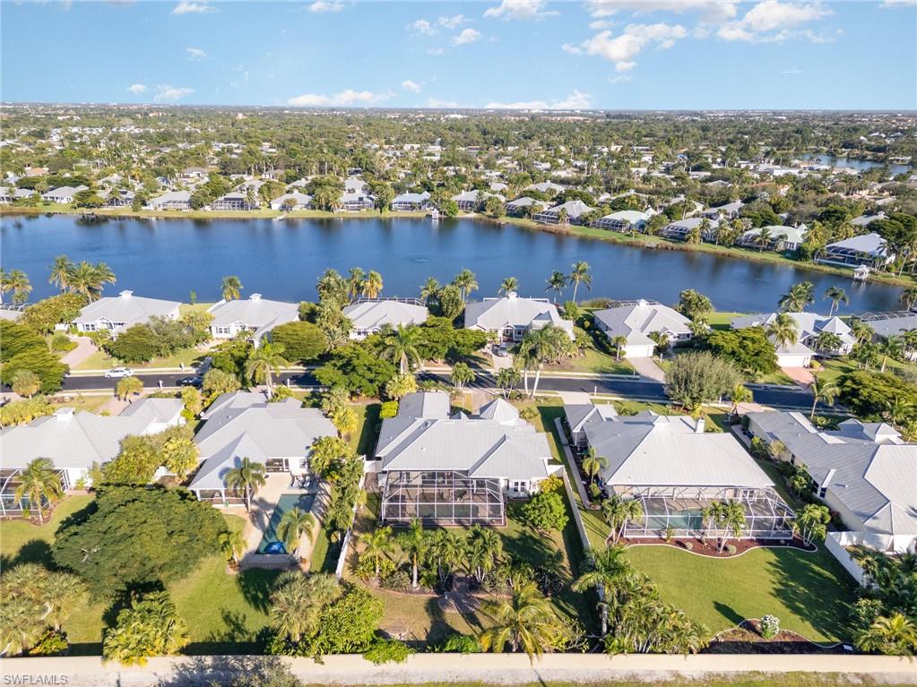 Aerial perspective of suburban area with a nearby body of water