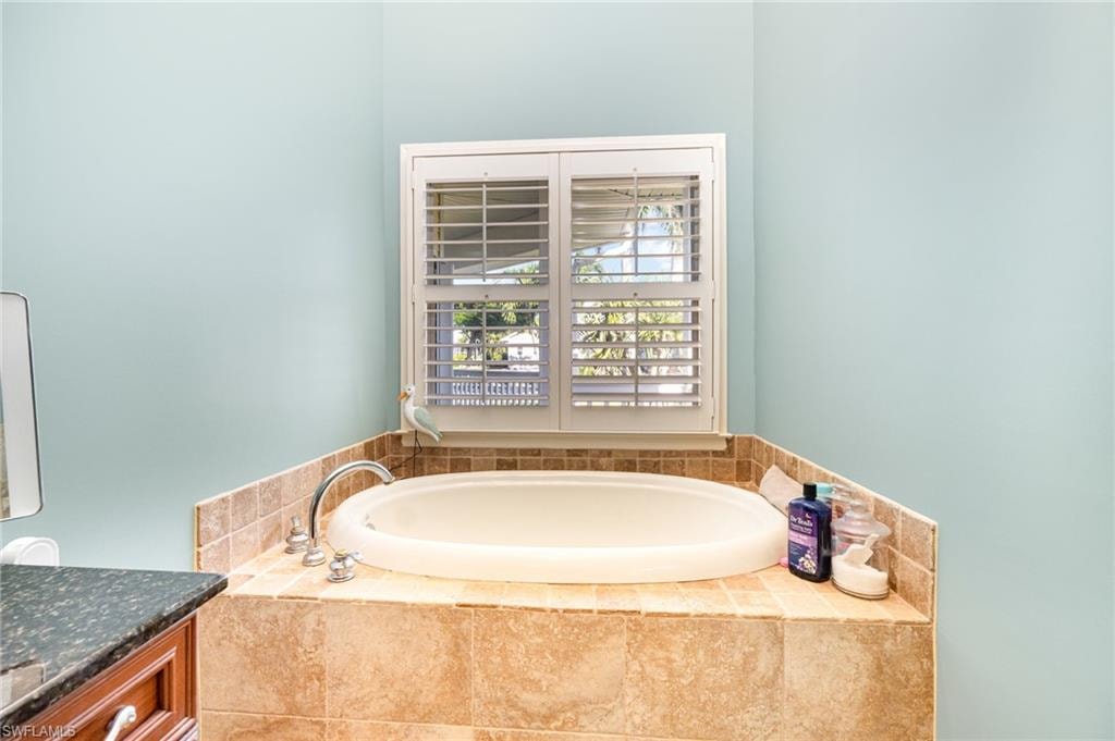 Bathroom with a garden tub and vanity