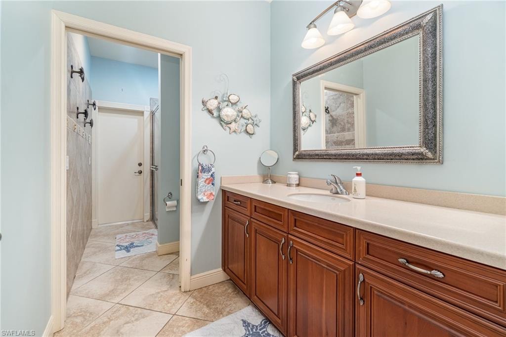 Bathroom featuring vanity and light tile patterned flooring