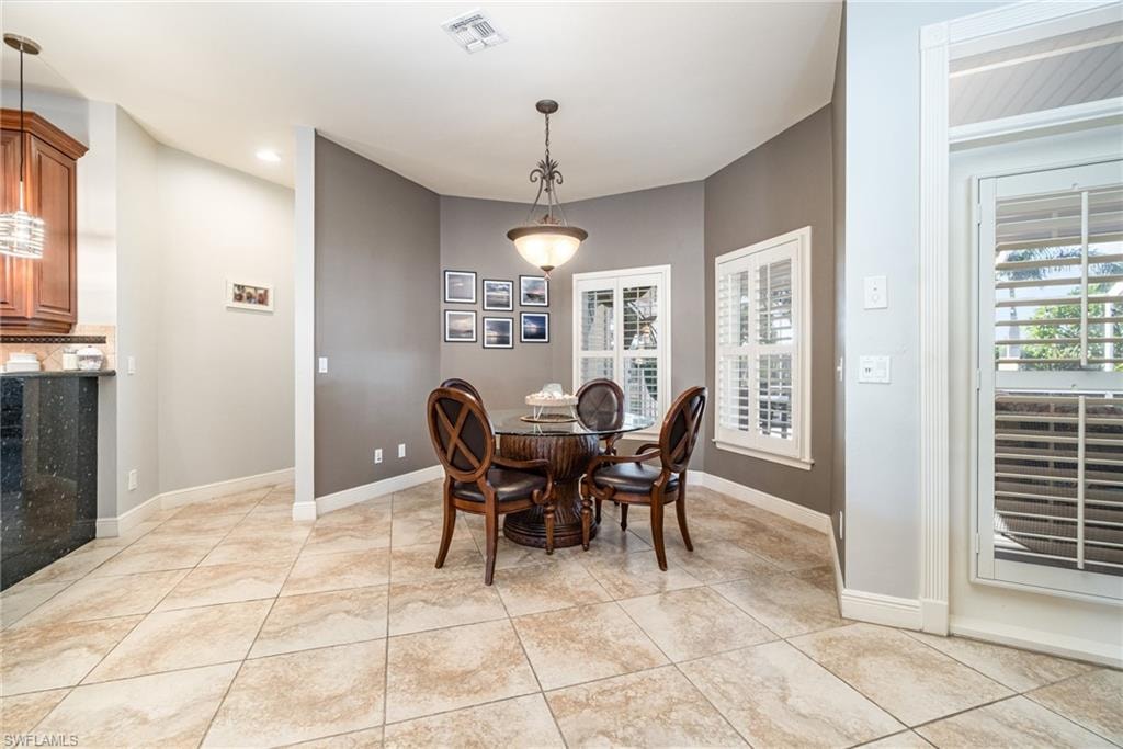 Dining room featuring light tile patterned floors