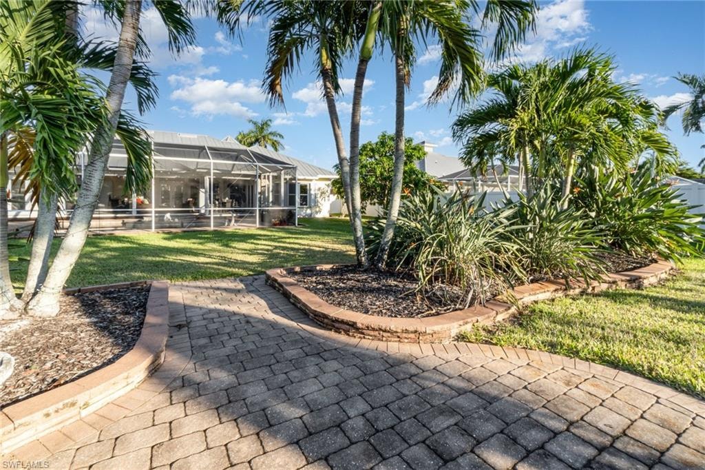 View of patio featuring a lanai and a sunroom