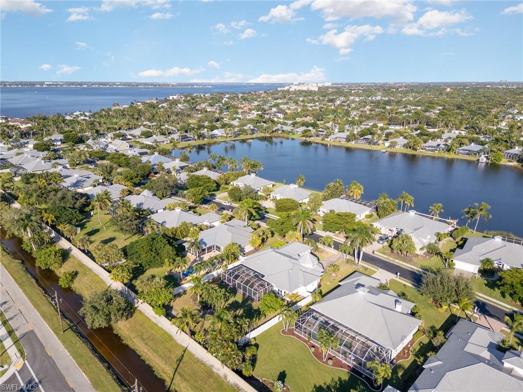 View of property location with a large body of water and nearby suburban area