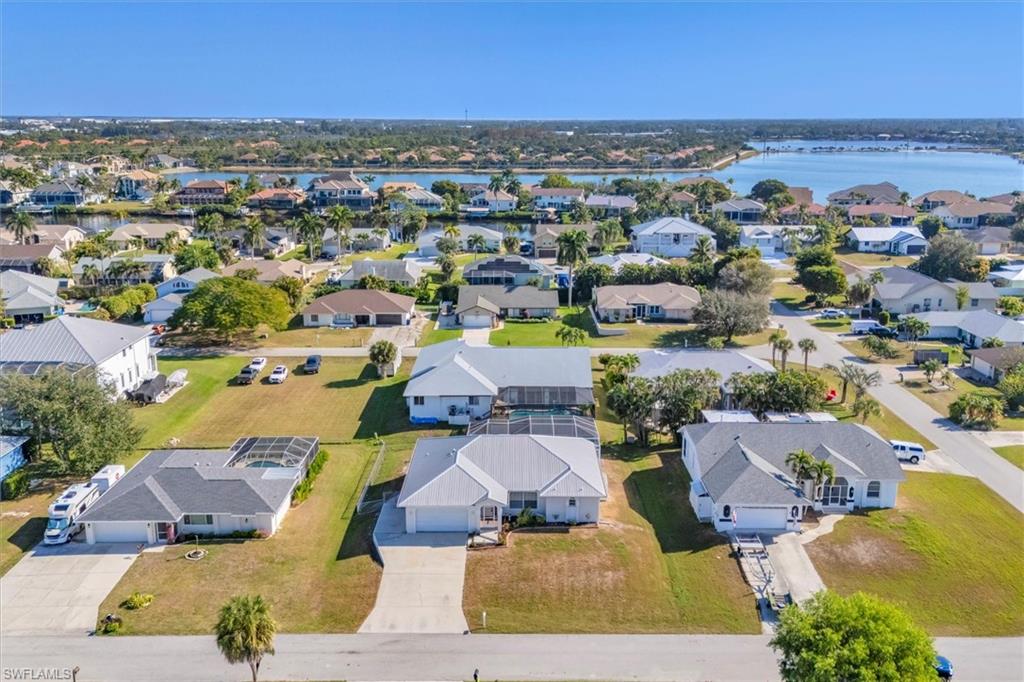 Aerial perspective of suburban area with a large body of water