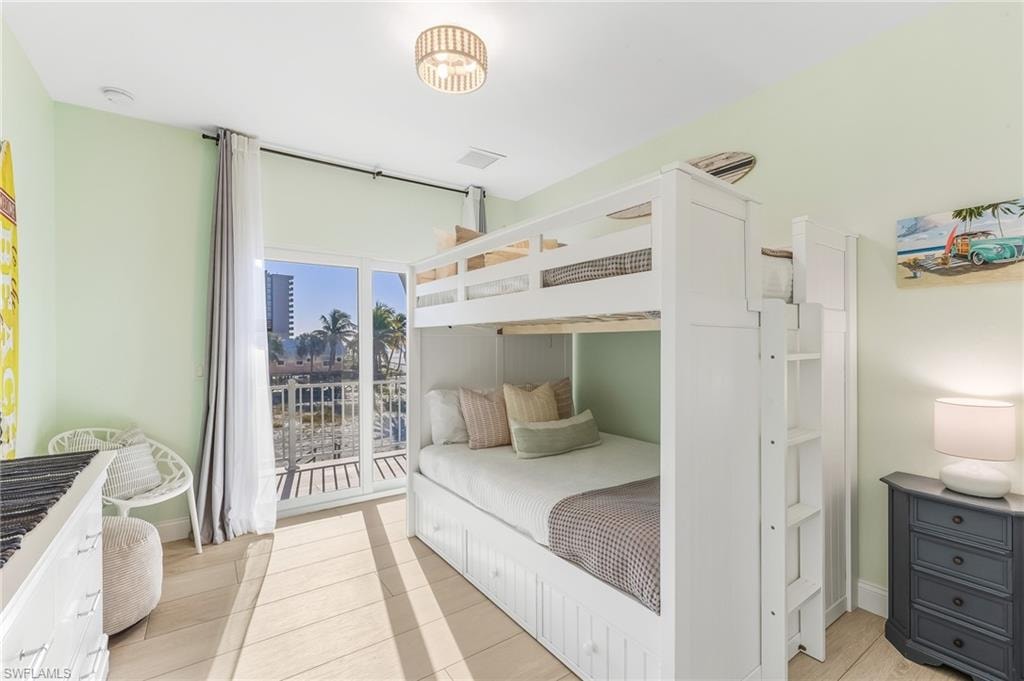 Bedroom featuring light tile patterned floors and baseboards