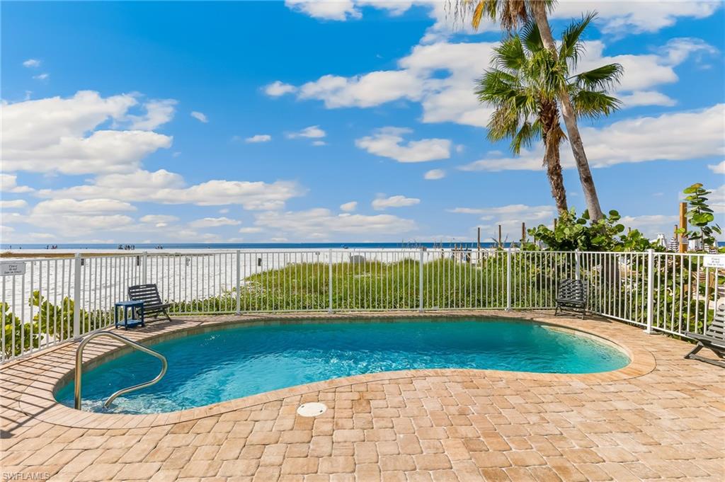 View of swimming pool featuring a water view