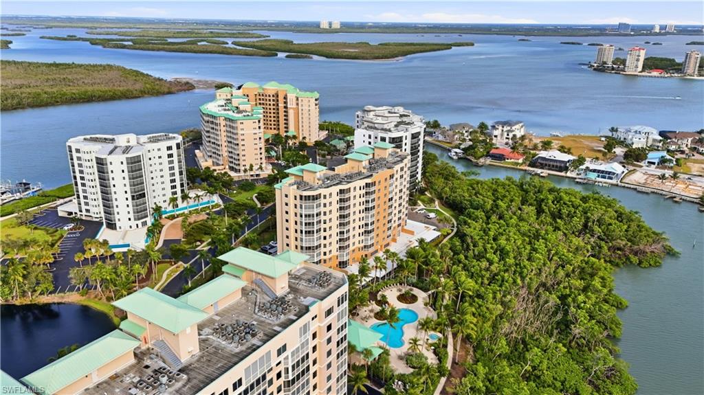 View of area featuring a nearby Lagoon and Bay  and apartment complex / building - Virtually Edited Image