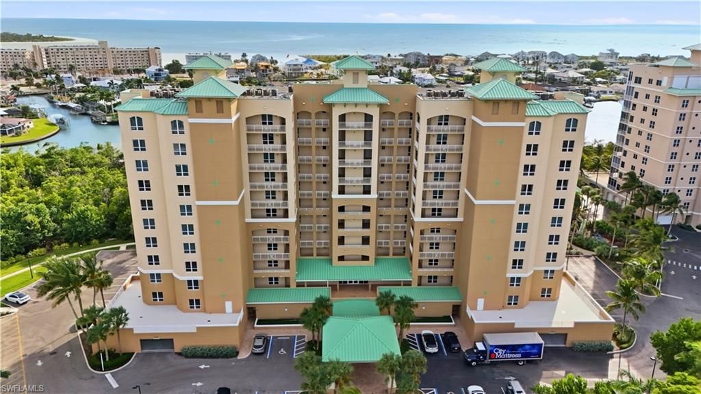 View of apartment building / complex with a water view - Virtually Edited Image