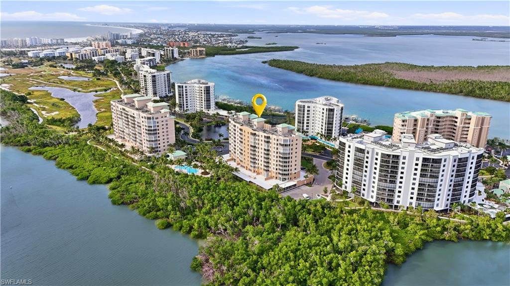 View of area featuring a nearby Lagoon and Bay and apartment complex - Virtually Edited Image
