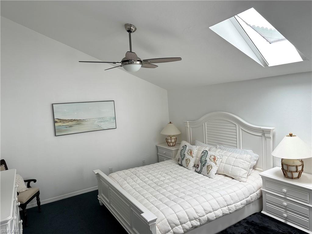 King bed,  lofted ceiling, skylight and ceiling fan