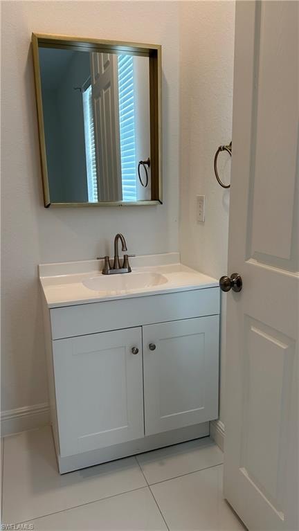 Bathroom with vanity and light tile patterned floors