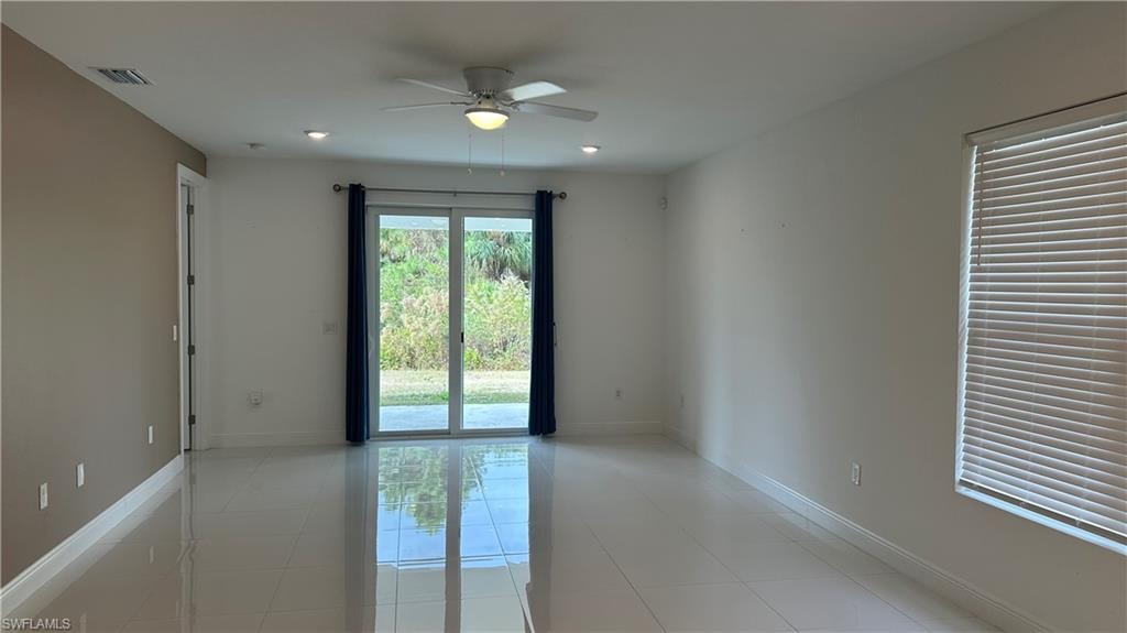 Spare room featuring a ceiling fan, light tile patterned floors, and recessed lighting