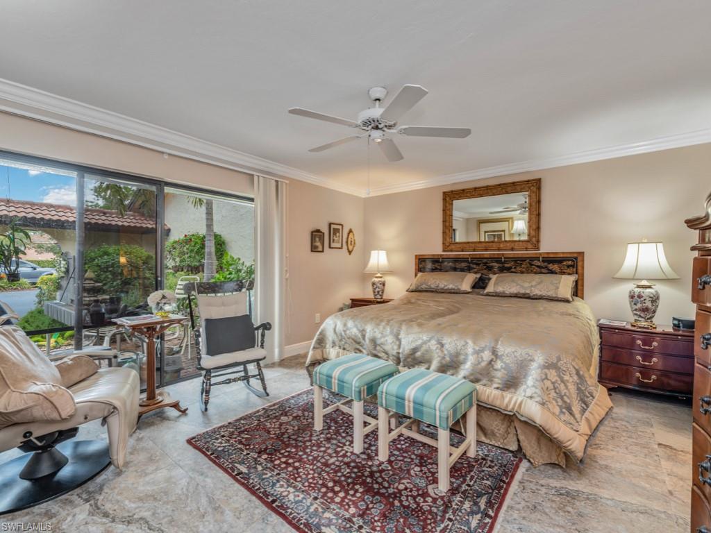Bedroom featuring access to exterior, ornamental molding, and a ceiling fan
