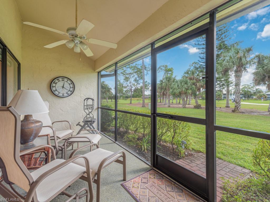 Sunroom featuring a ceiling fan and vaulted ceiling