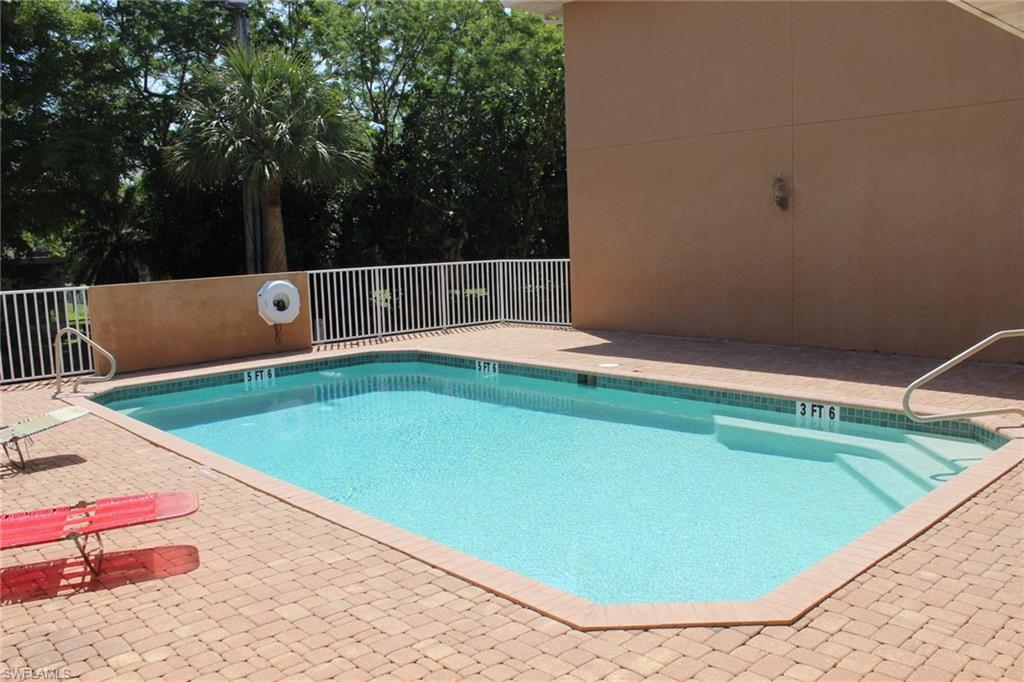 Community pool featuring a patio area