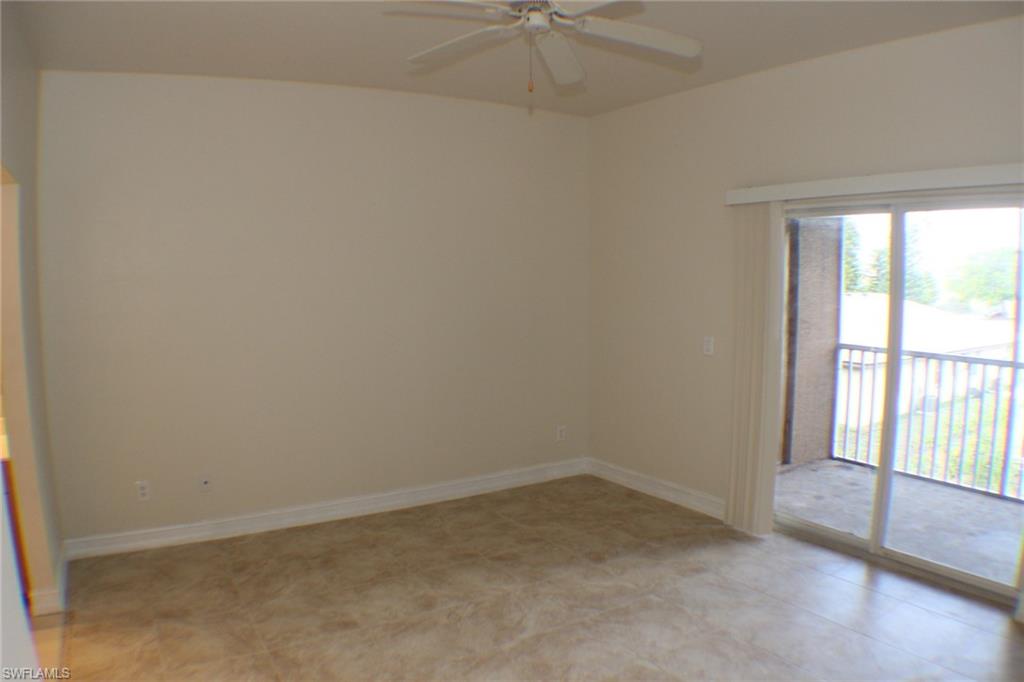 Empty room with baseboards and ceiling fan
