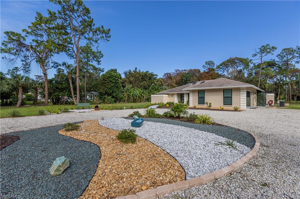 View of front facade and circular driveway