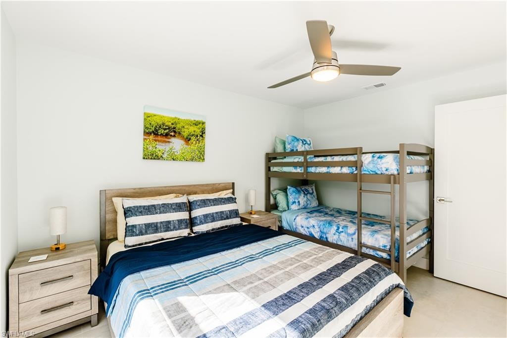 Bedroom featuring Queen size bed, bunk with 2 twin beds and 2 nightstands