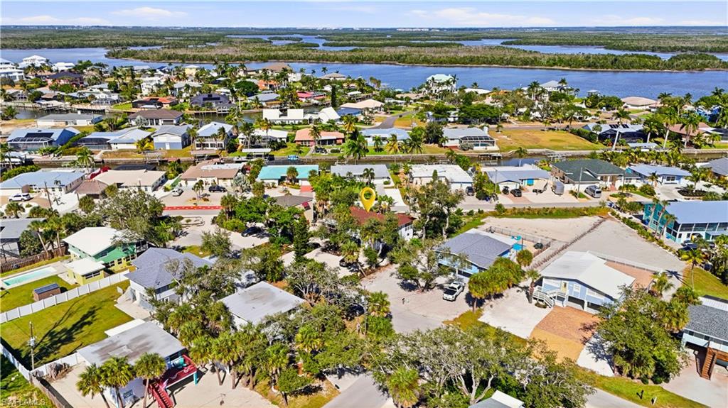 Aerial view of residential area with a large body of water - Virtually Edited Image