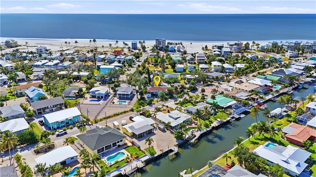 Aerial perspective of suburban area with a large body of water - Virtually Edited Image