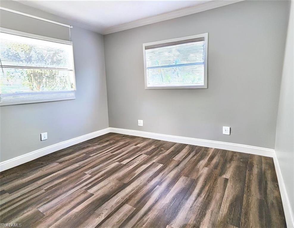 Bedroom featuring wood-type flooring VIRTUALLY EDITED