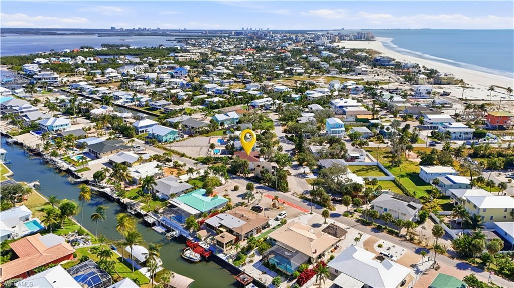 Aerial perspective of suburban area with expansive coastline - Virtually Edited Image