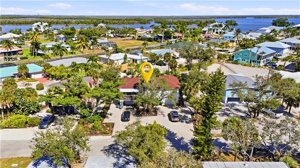 Aerial view of residential area with a nearby body of water - Virtually Edited Image