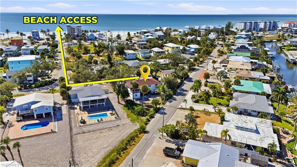 BEACH ACCESS - Aerial perspective of suburban area with a large body of water - Virtually Edited Image