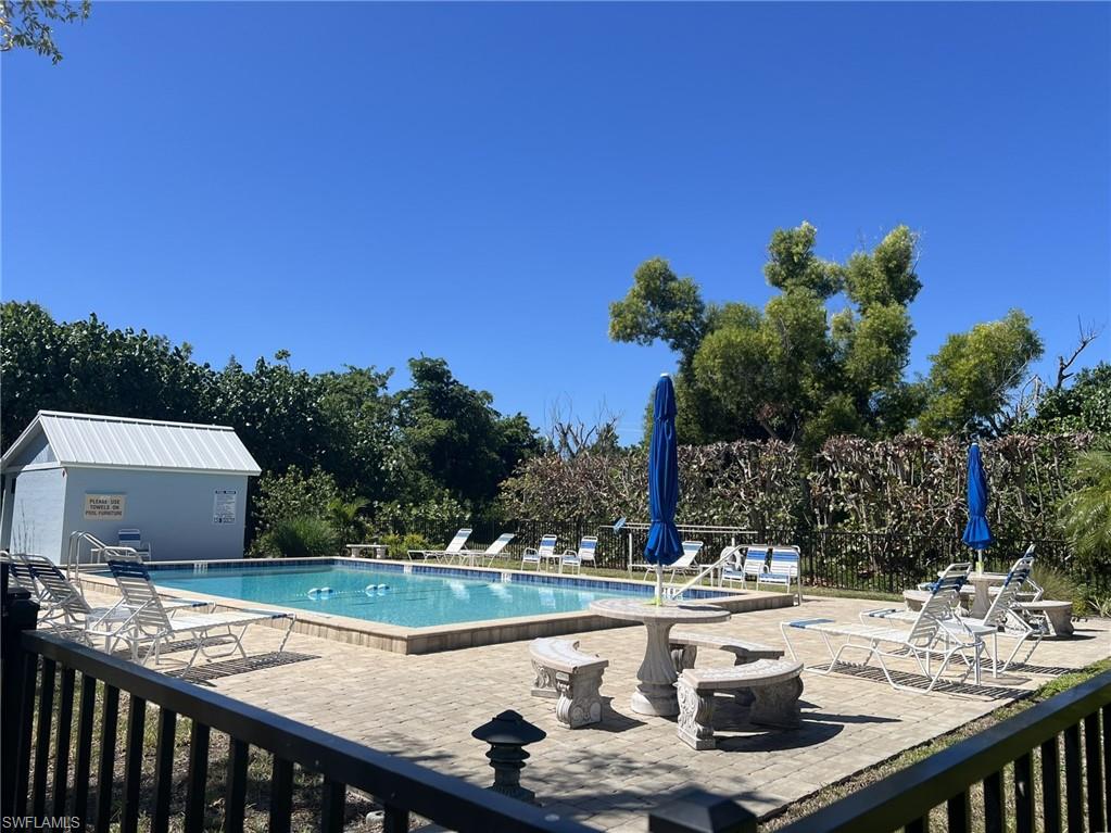 Community pool with a patio area