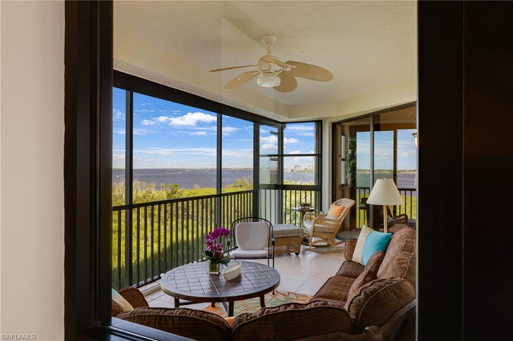 Primary Bedroom featuring crown molding, direct access to Terrace and spectacular views of Caloosahatchee River.