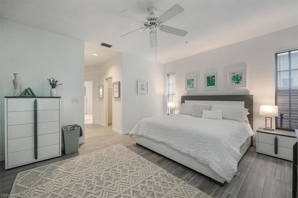 Bedroom with wood finished floors and a ceiling fan