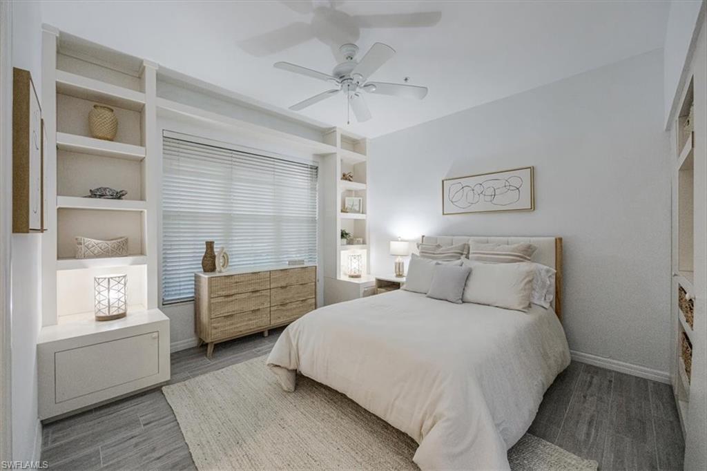 Bedroom with wood finished floors and a ceiling fan