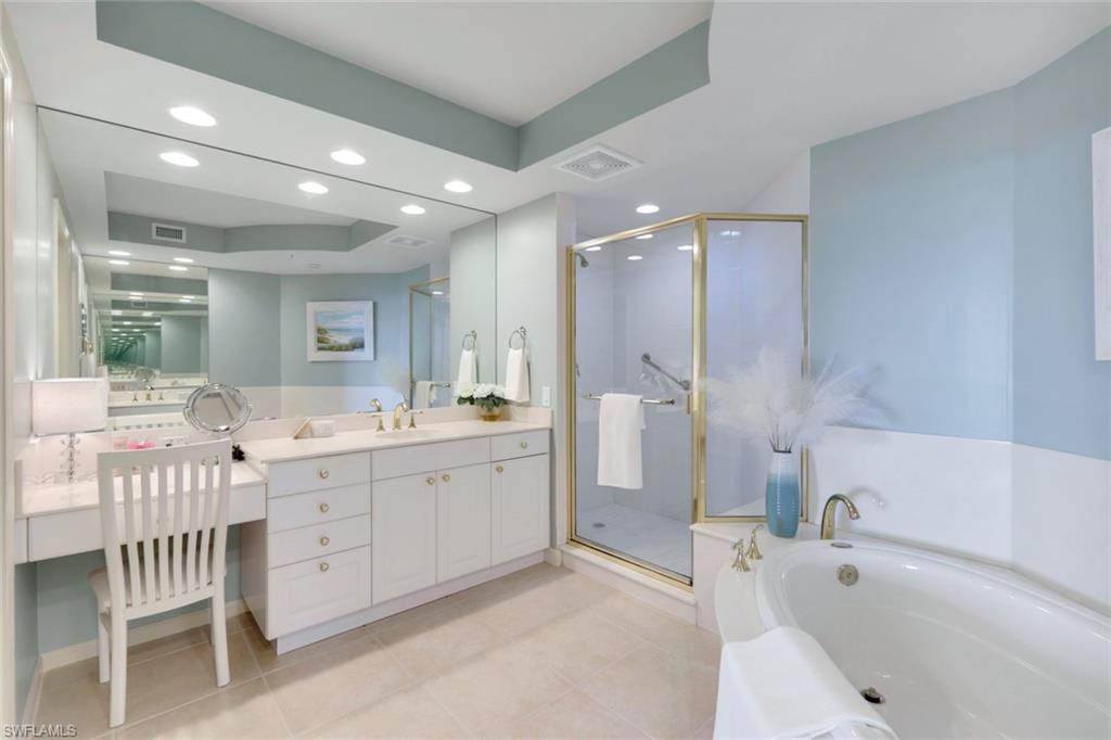 Master bath with shower and soaking tub and dual sinks