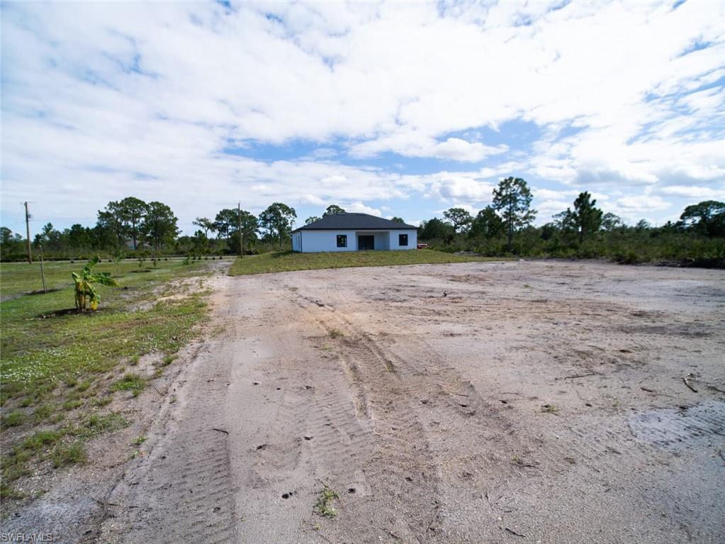 View of back of home featuring a view of rural / pastoral area