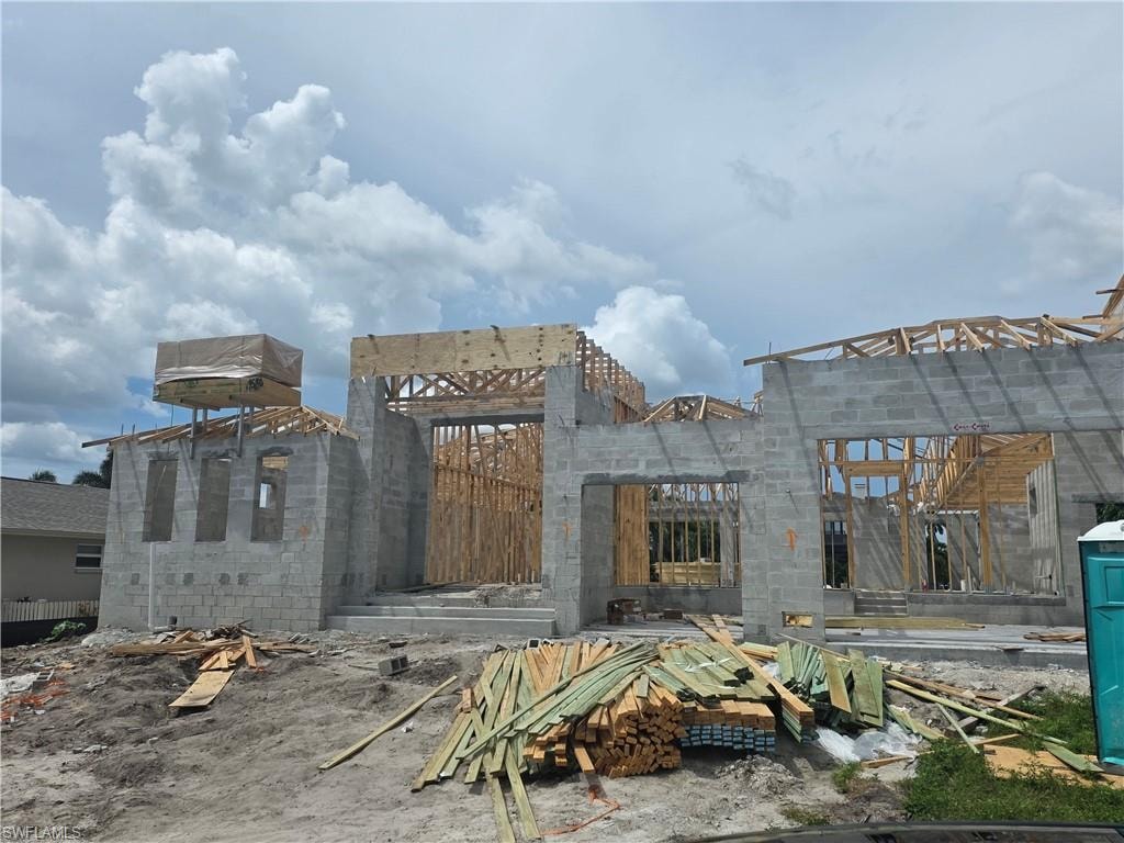 Concrete block construction featuring a prominent entry and multi-level roof framing