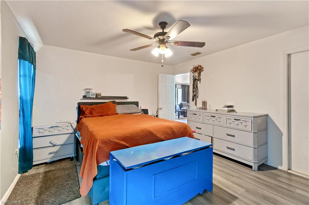 Bedroom featuring light wood-type flooring and ceiling fan