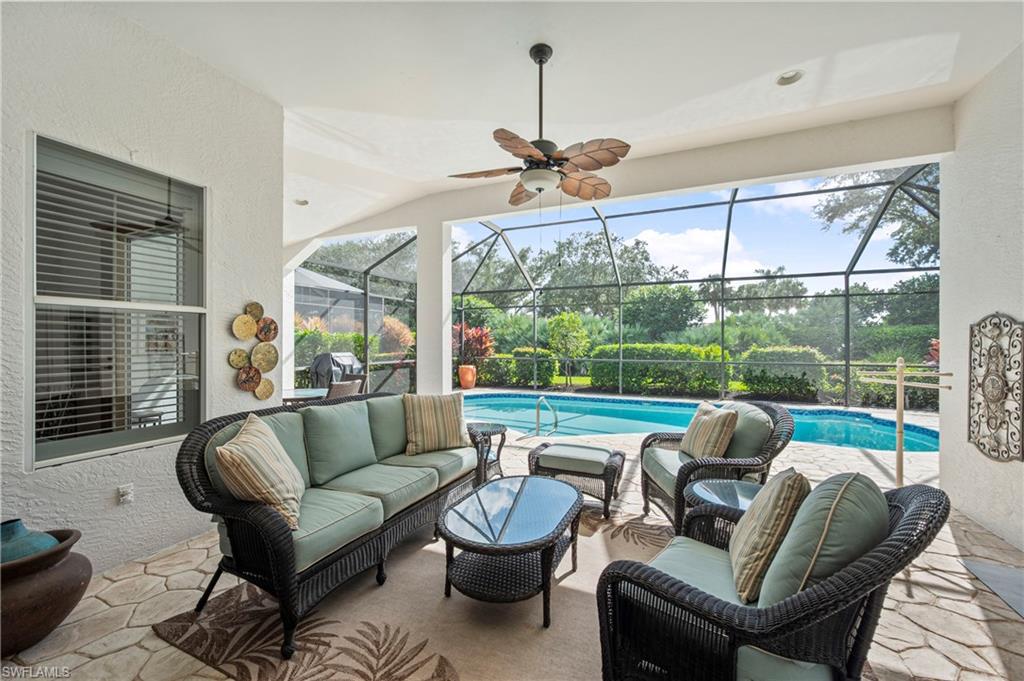 View of patio / terrace featuring a sunroom, outdoor lounge area, a lanai, and ceiling fan