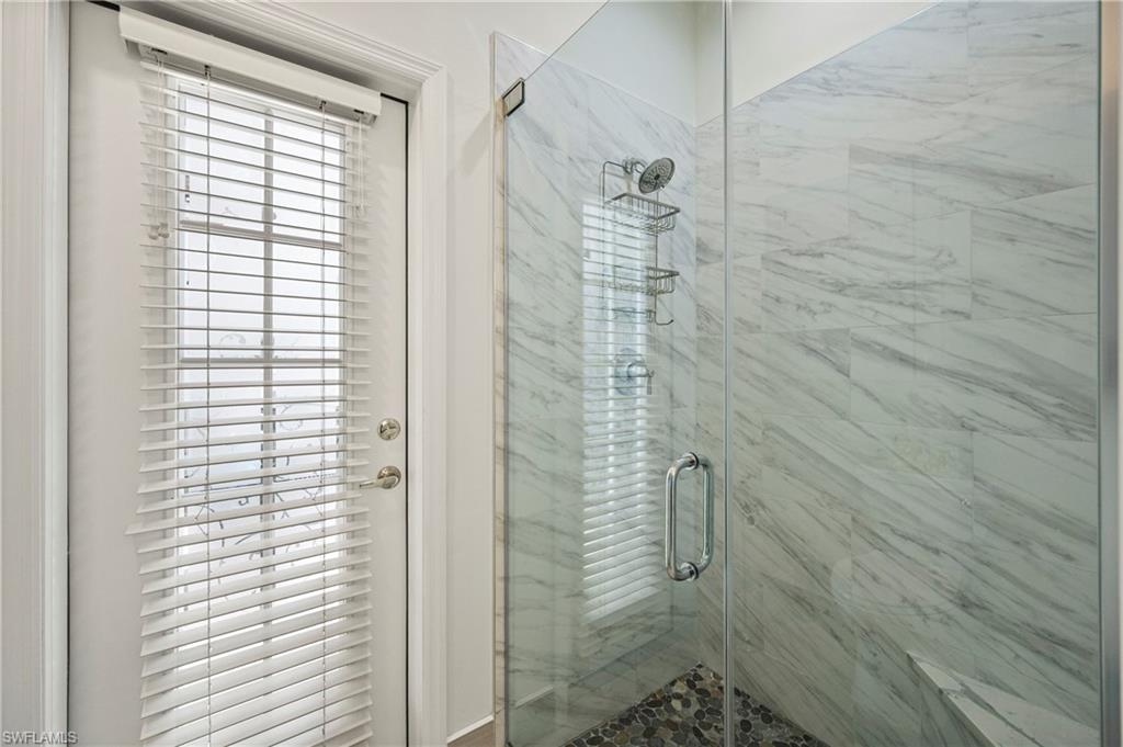 Full bathroom with a stall shower and plenty of natural light