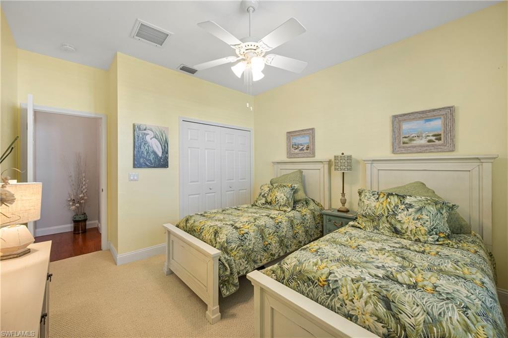 Bedroom with a closet and a ceiling fan