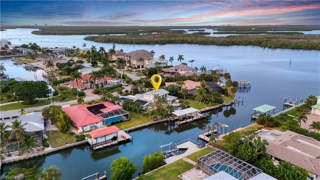 Bird's eye view with a water view  -Virtually enhanced image