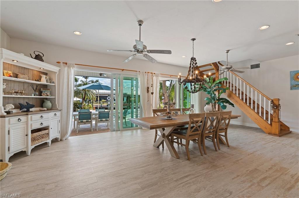 Dining room with ceiling fan and lightwood look tile flooring