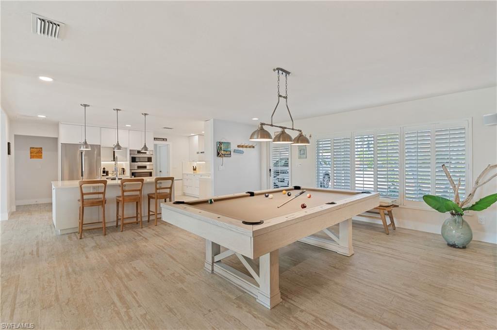 Game room featuring pool table and light wood look tile flooring