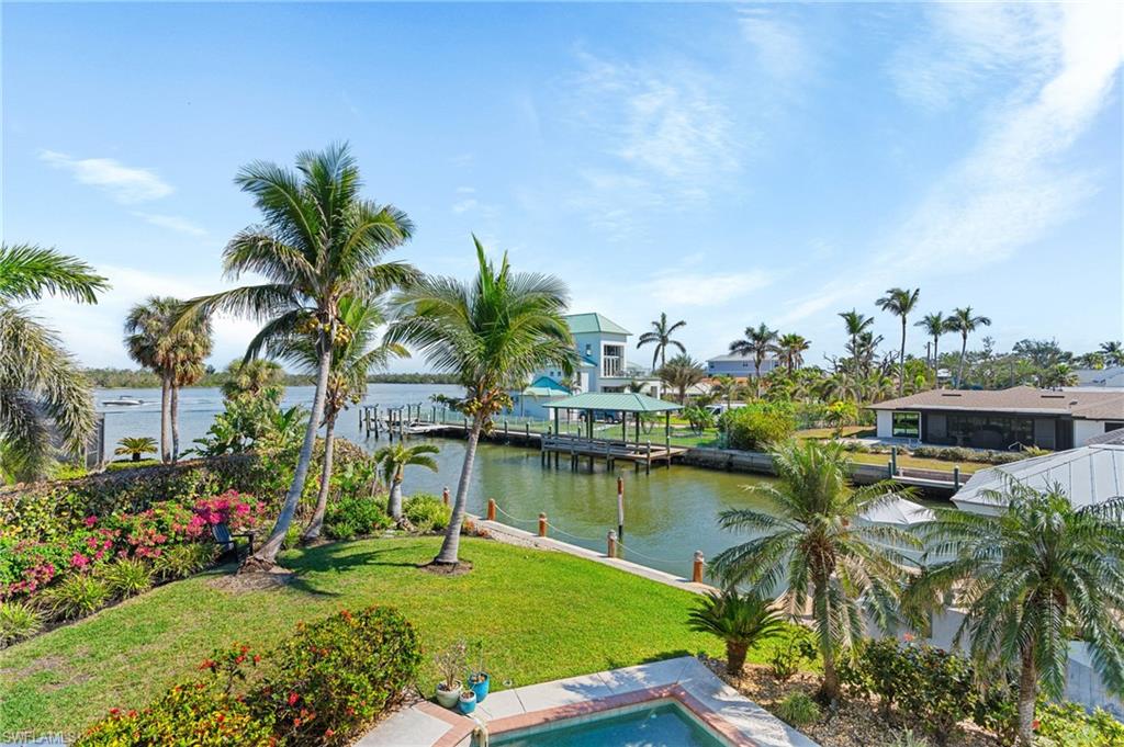 Water view featuring a boat dock  -Virtually enhanced image
