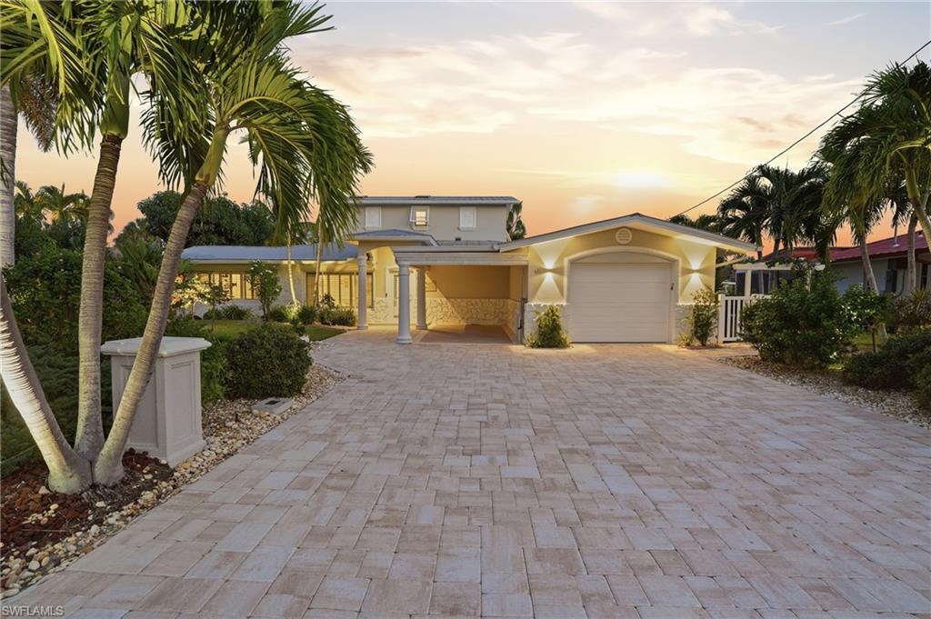 View of front facade with a garage -Virtually enhanced image