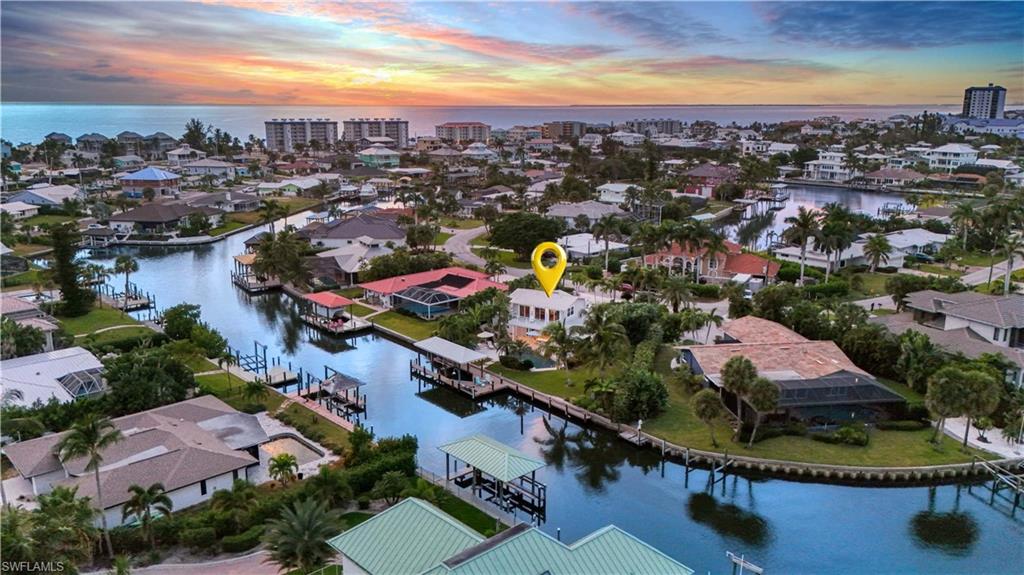 Aerial view featuring a water view  -Virtually enhanced image